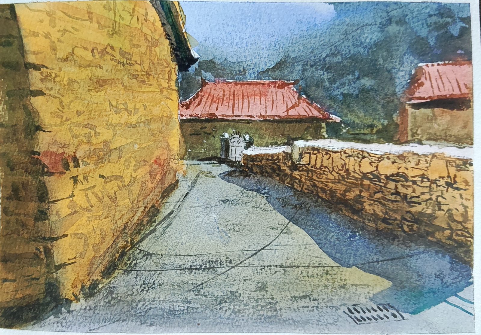 Watercolor of a sunlit village lane between stone walls and red-tiled roofs