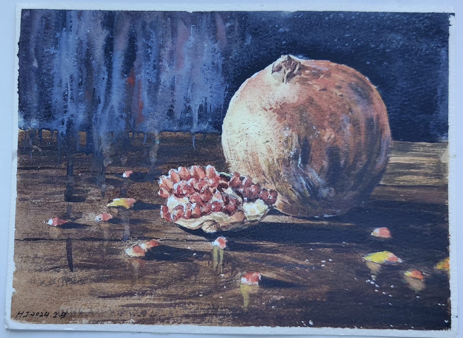 Watercolor still life of a split pomegranate on a dark table