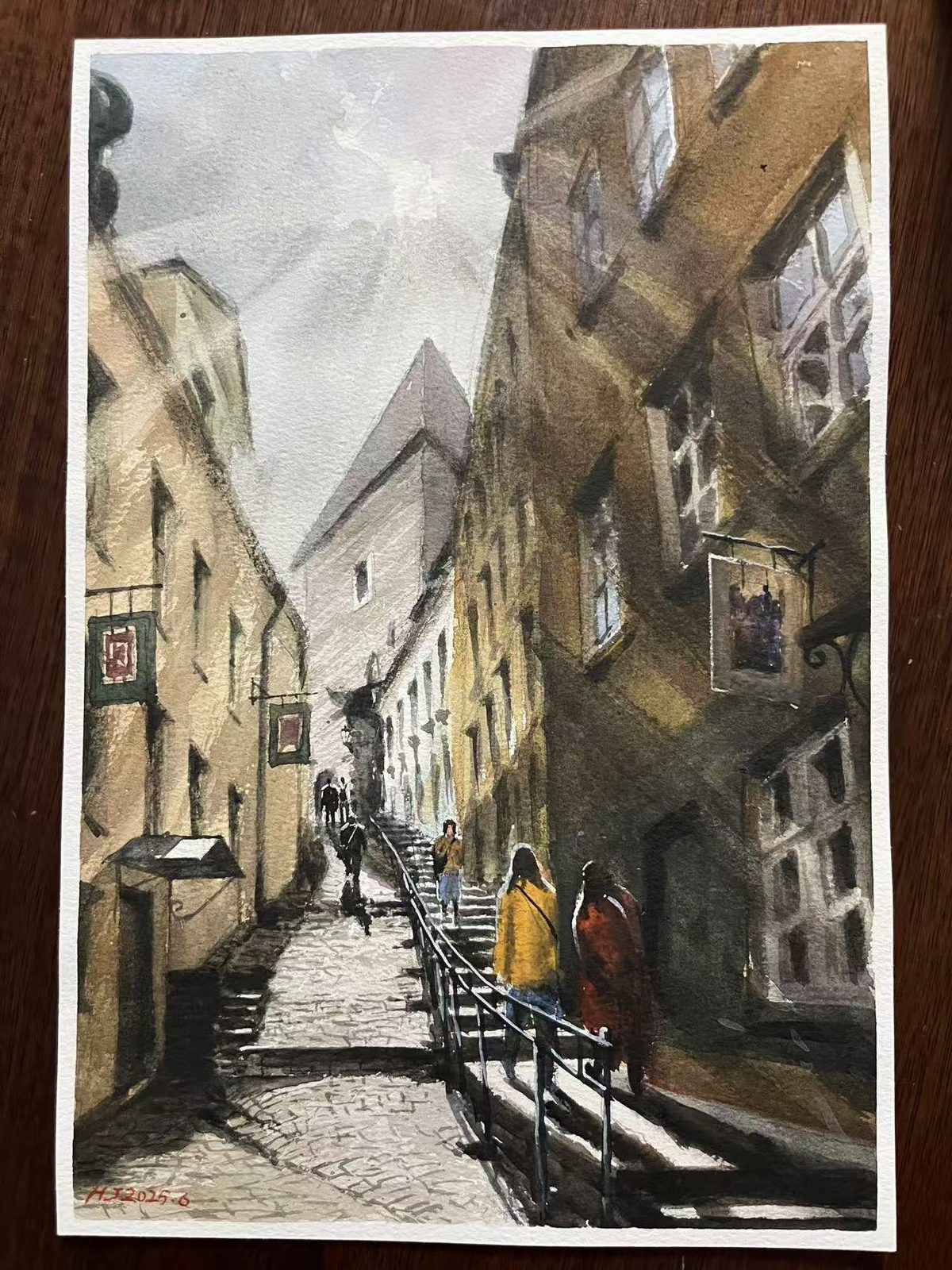 Watercolor of a narrow old-town lane with steps and two figures in the light
